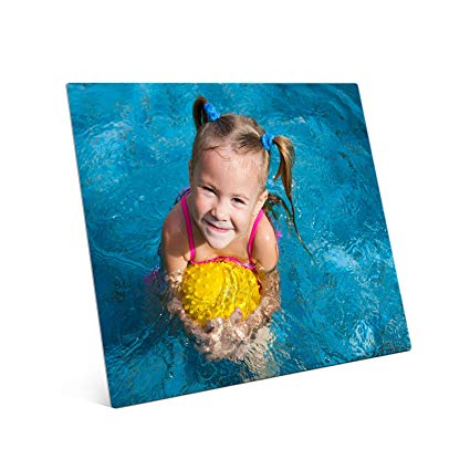 Small girl playing in swimming pool